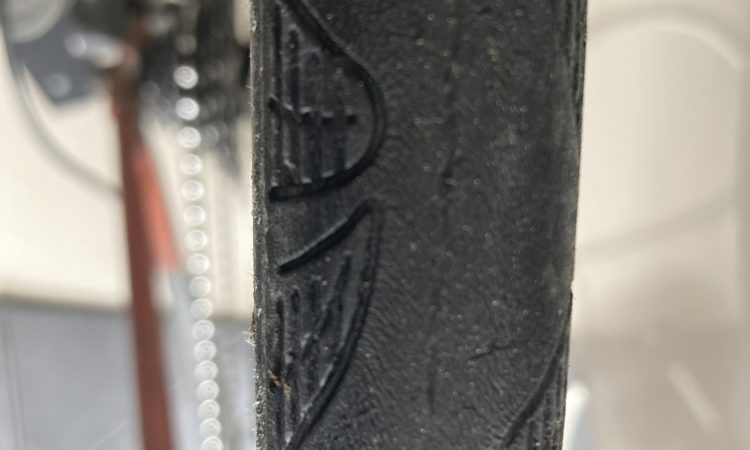 Tyre fibres showing through as the rubber has been torn away
