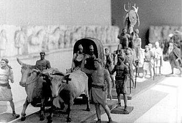 Some troops and a chariot pulled by oxen