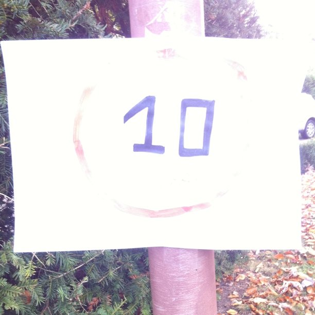 Children's sign to stop people driving fast
