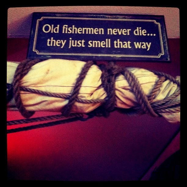 At a cafe where they have amusing signs.