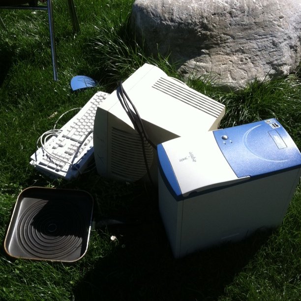 Aspire computer in grass with a frying pan.