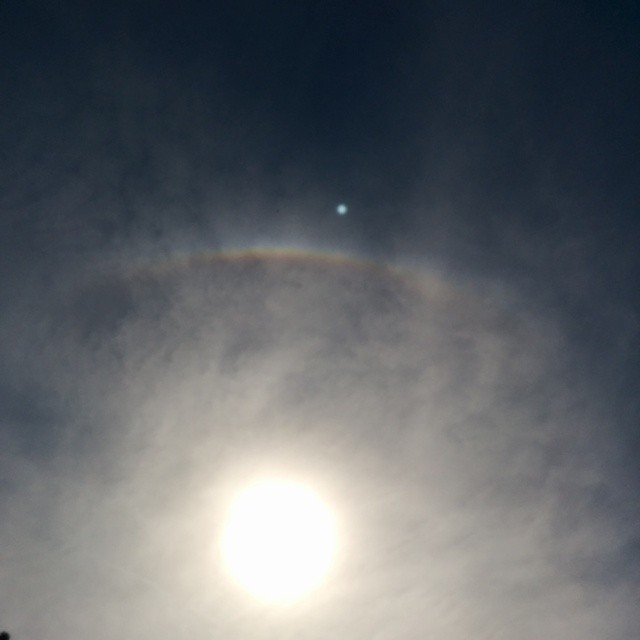 I was watching a biplane and noticed the rainbow.