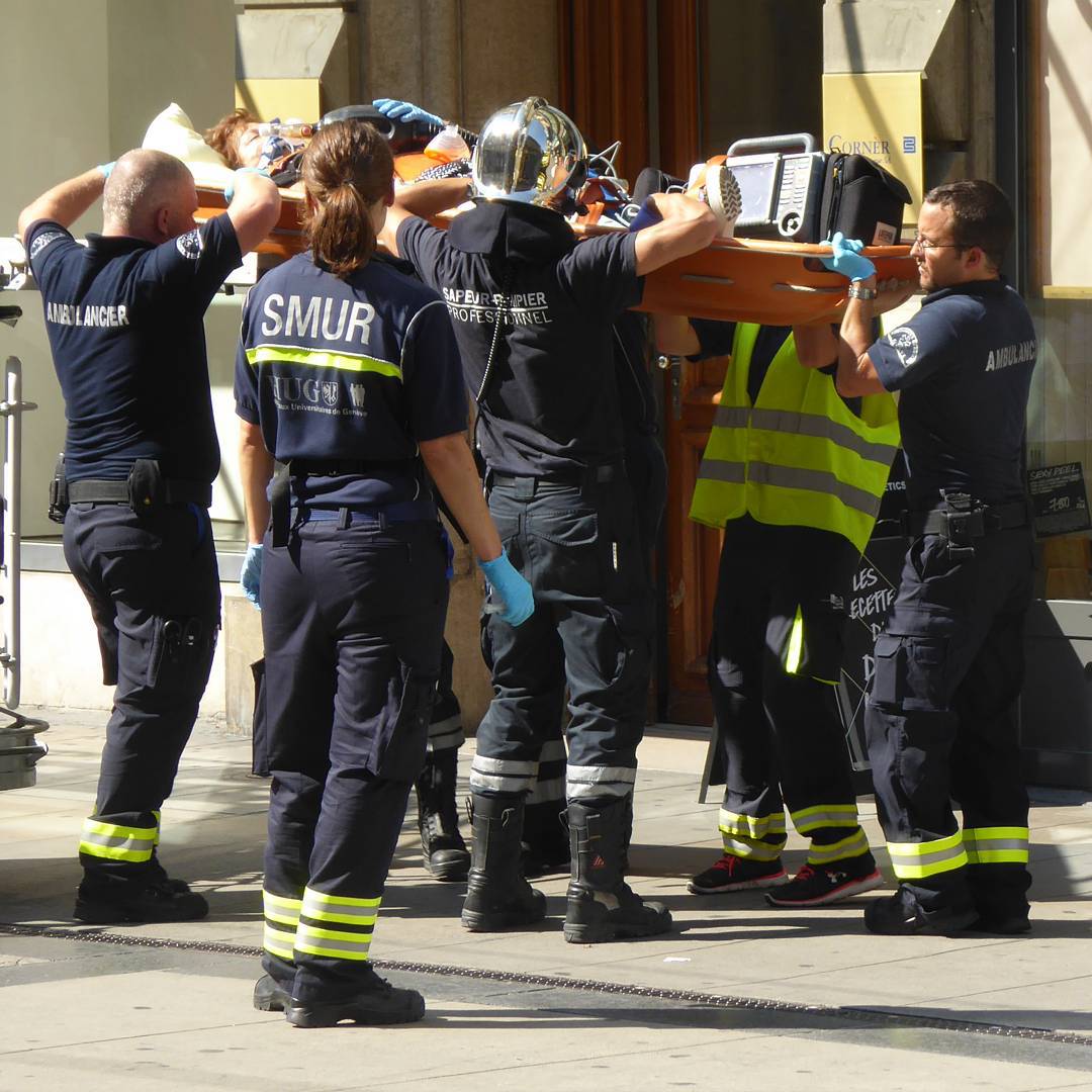 Emergency staff taking care of a patient.
