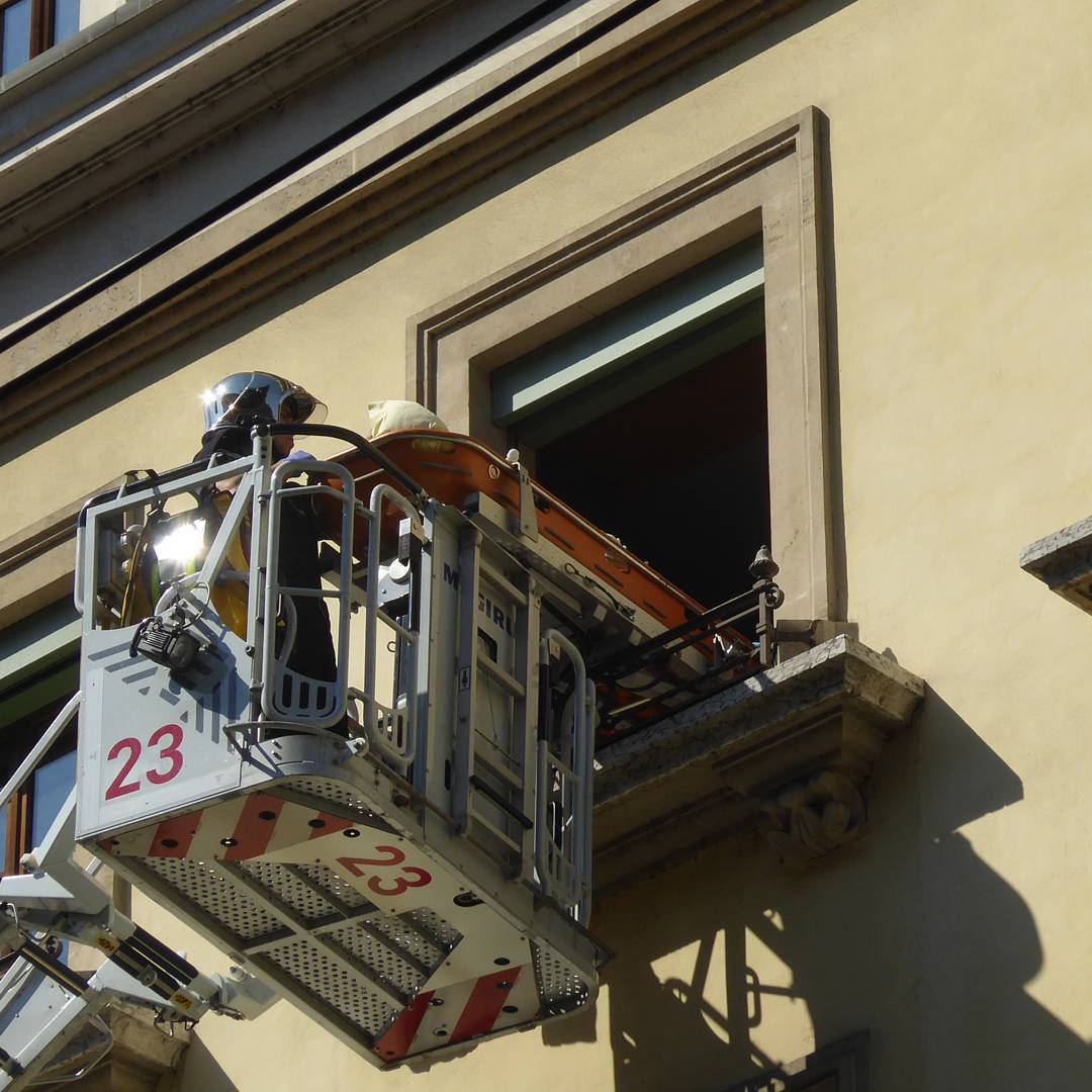 A woman is evacuated from her apartment following a medical emergency.