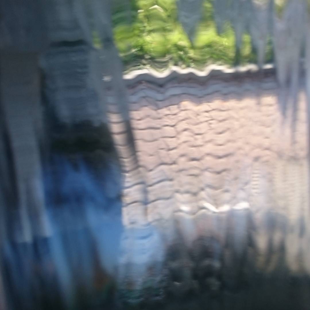 Taken through a curtain of water from a fountain.