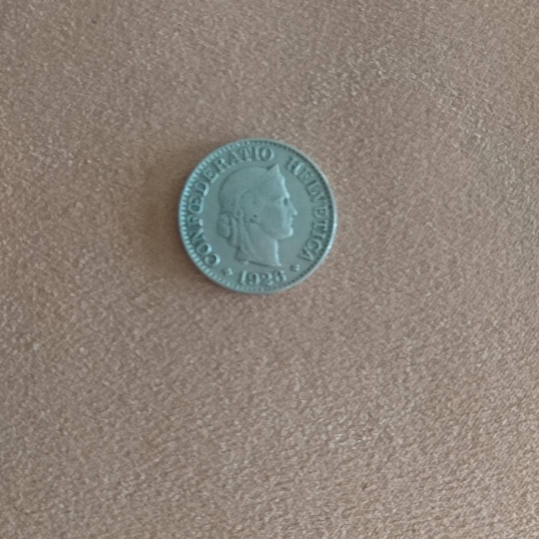 I was looking through my coins and noticed a difference. When I looked closer I saw that it dates back to 1926. :-D