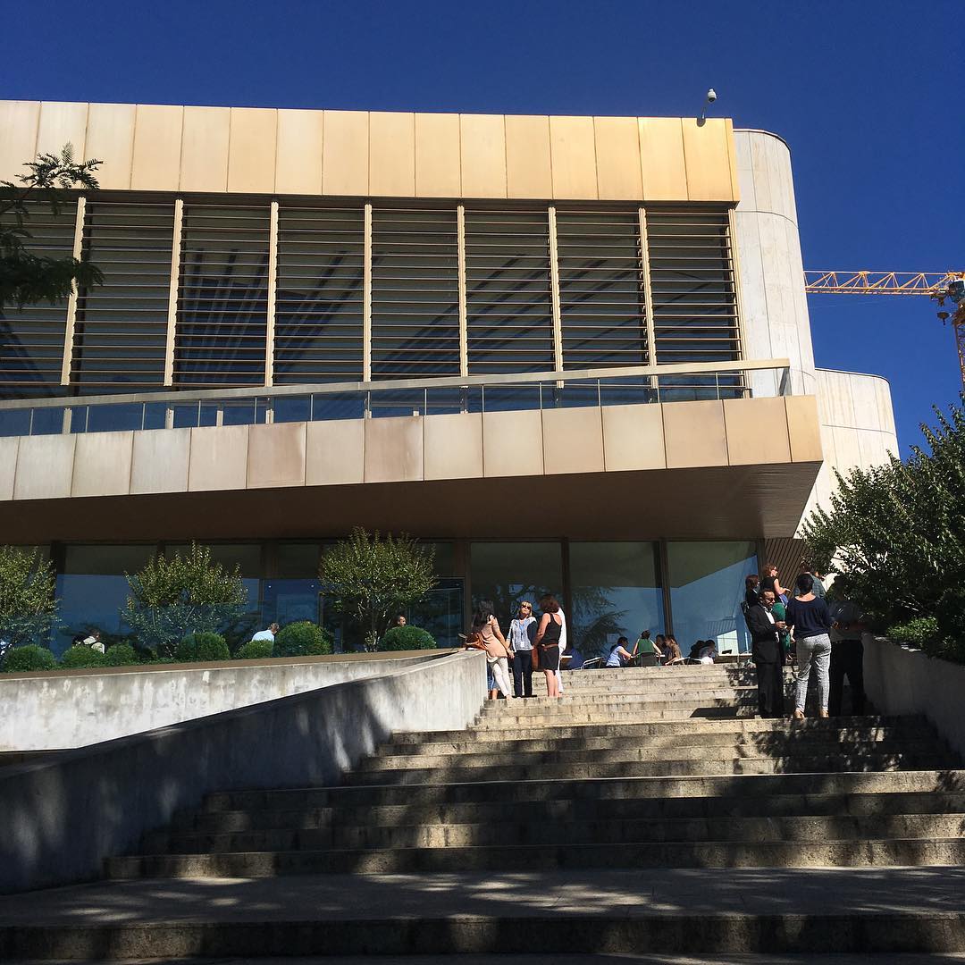 People having conversations at the palace of nations.