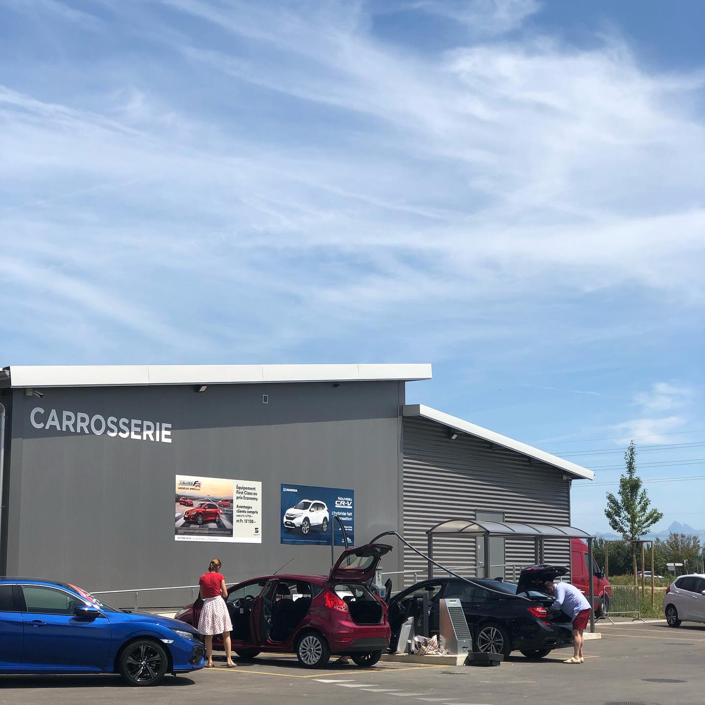 Nothing says Swiss national holiday like putzing a car.